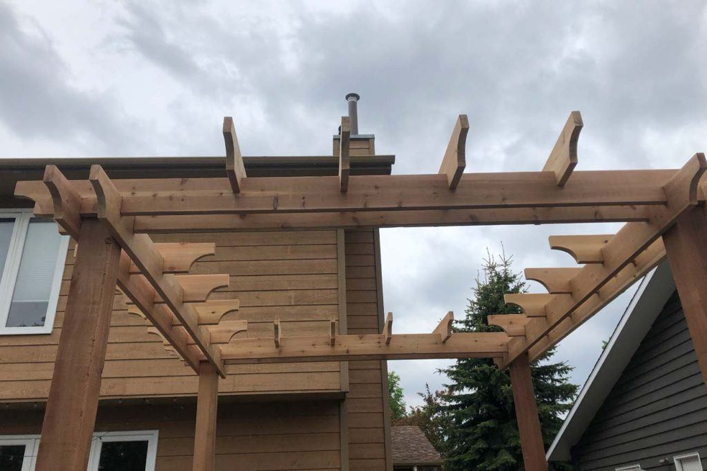 a close up photo of a wooden pergola