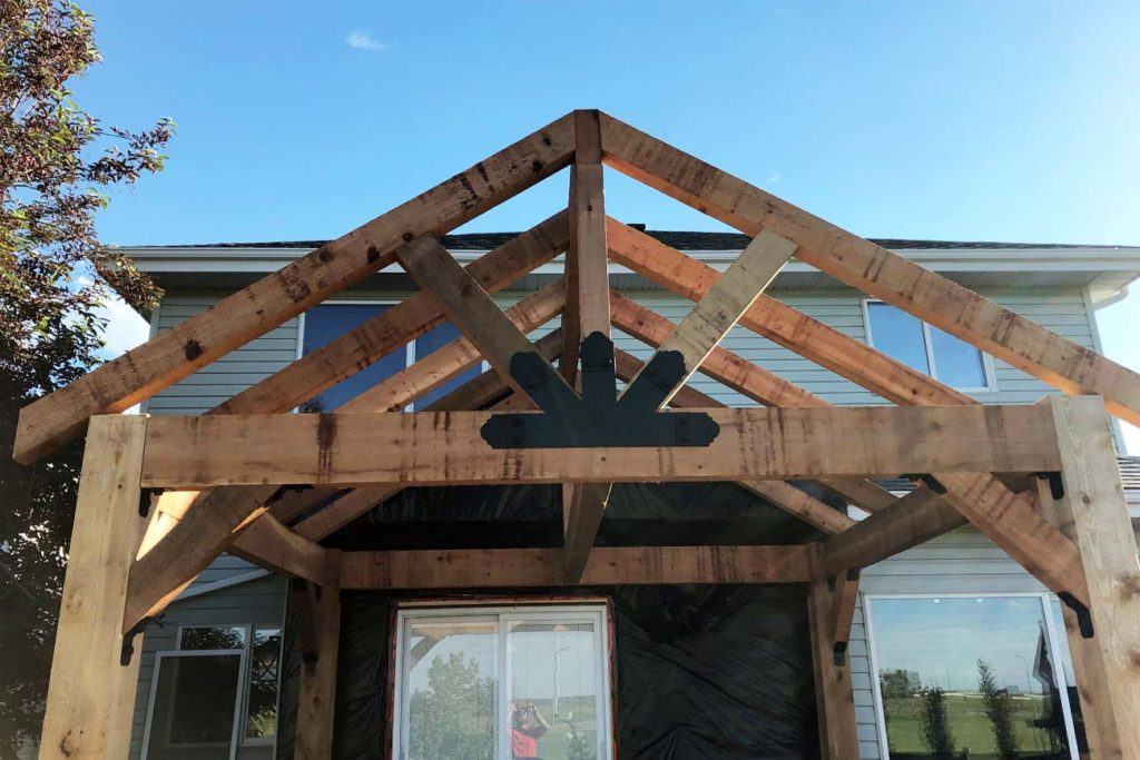 a wooden pergola in a backyard