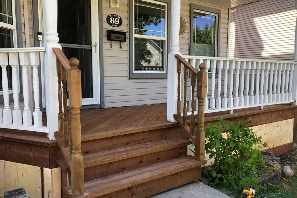 outdoor photo of a house with three wooden steps and a wood front porch