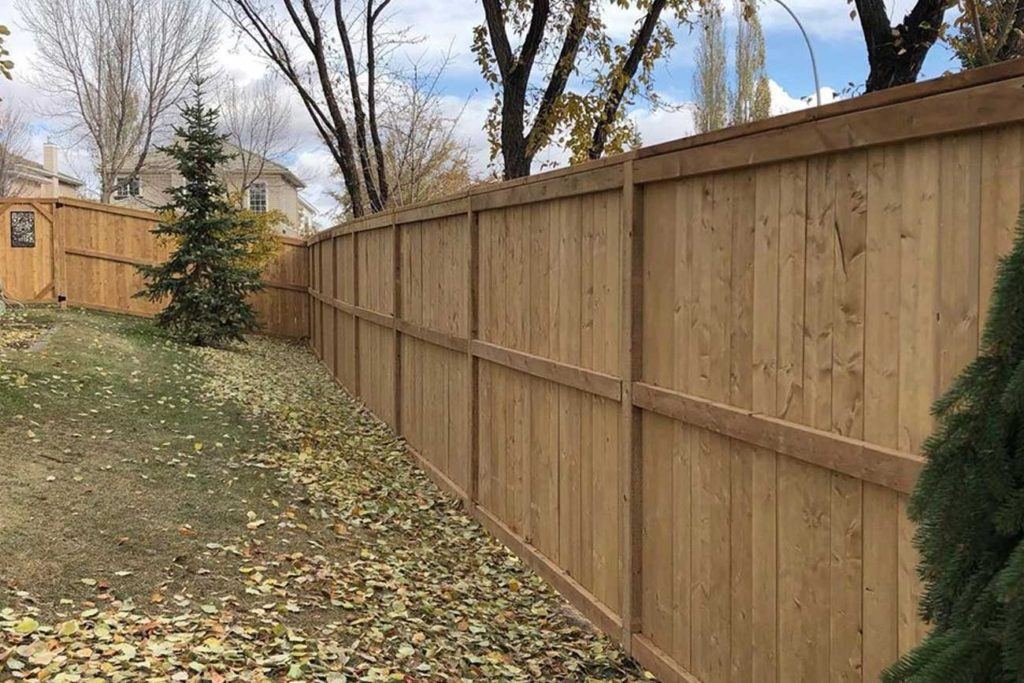 outdoor photo of a wooden fence in a backyard