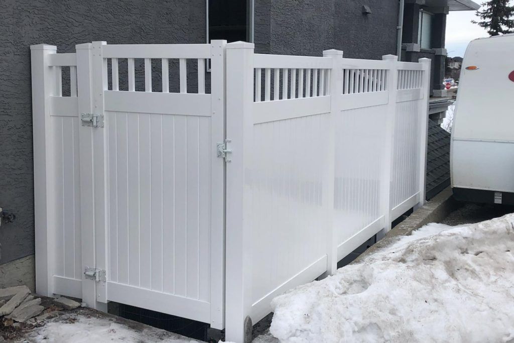 a backyard white gate and fencing