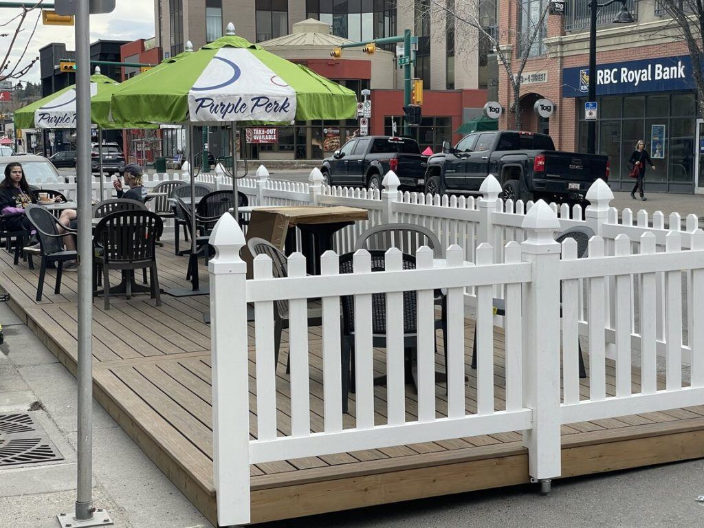 White Fencing with table & chair kept inside the fencing.